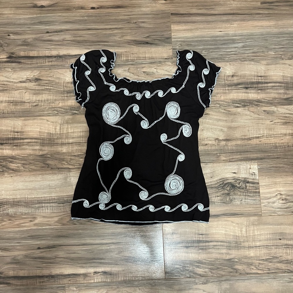 A cute, brown, patterned, loose fitting shirt